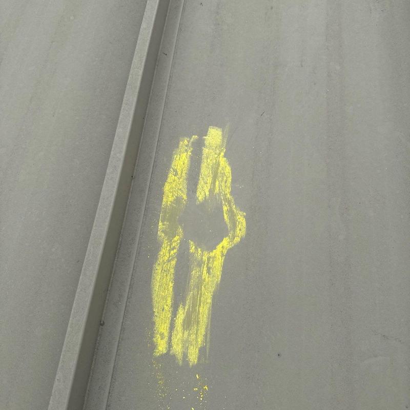Commercial metal roofing hail damage marked in yellow