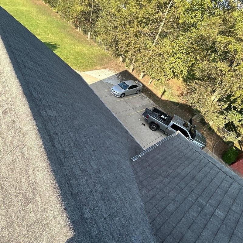 Asphalt shingle roof with hail damage inspection