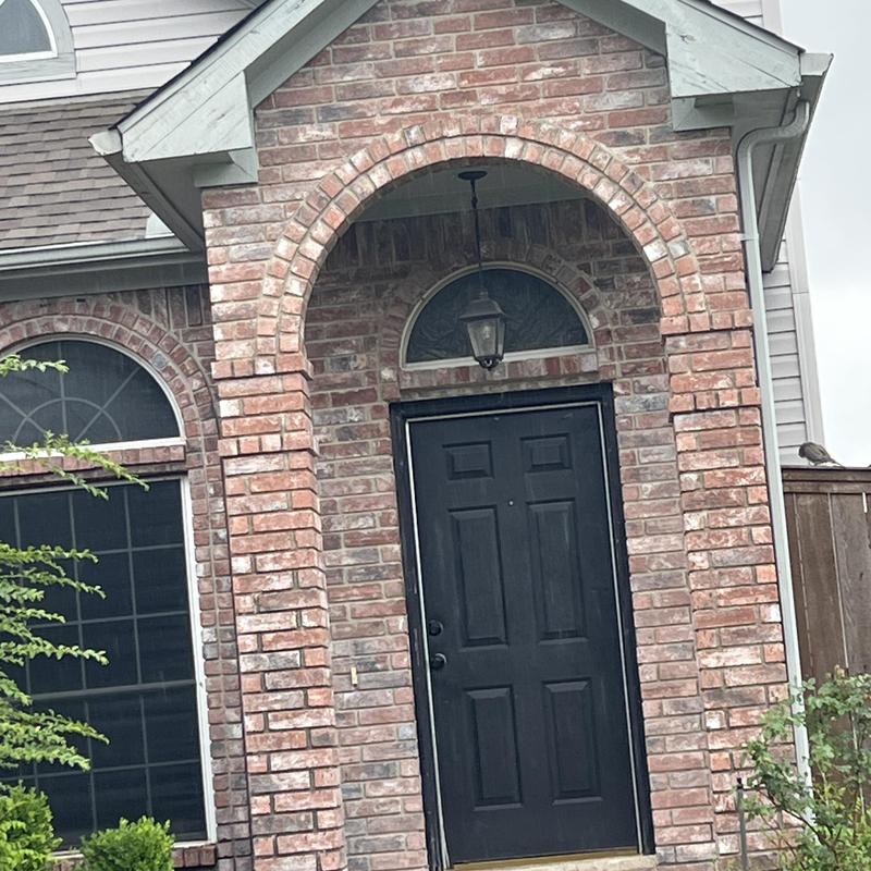Front door and brick arch entrance in Mesquite, TX