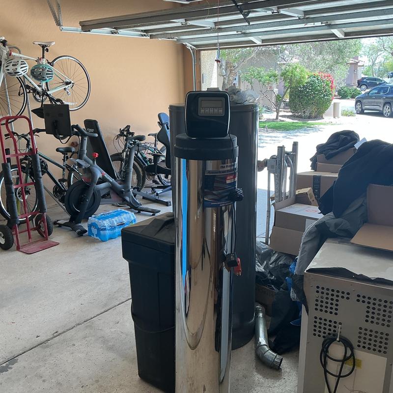 Water softener system installed in garage space Water softener system installed in garage space