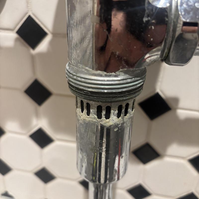 Men's urinal Sloan valve with mineral buildup Men's urinal Sloan valve with mineral buildup