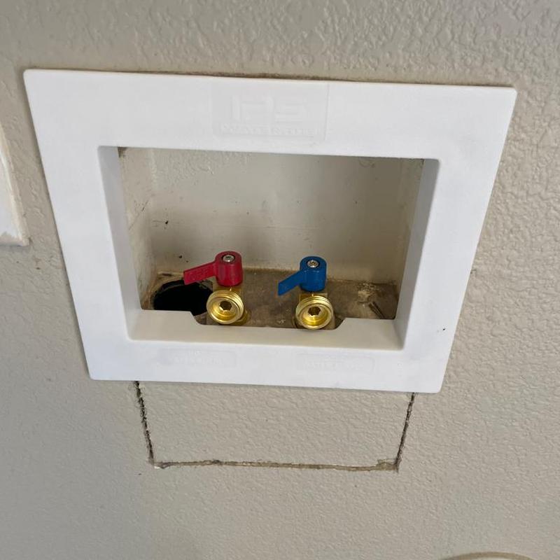 Washer box valves with red and blue handles installed