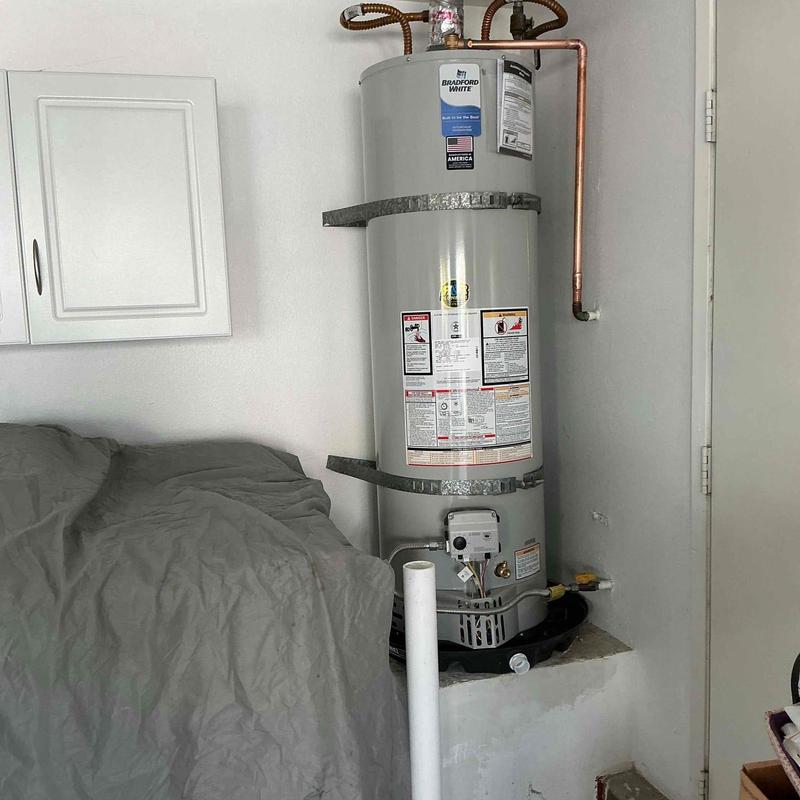 40-gallon water heater with raised catch pan installed