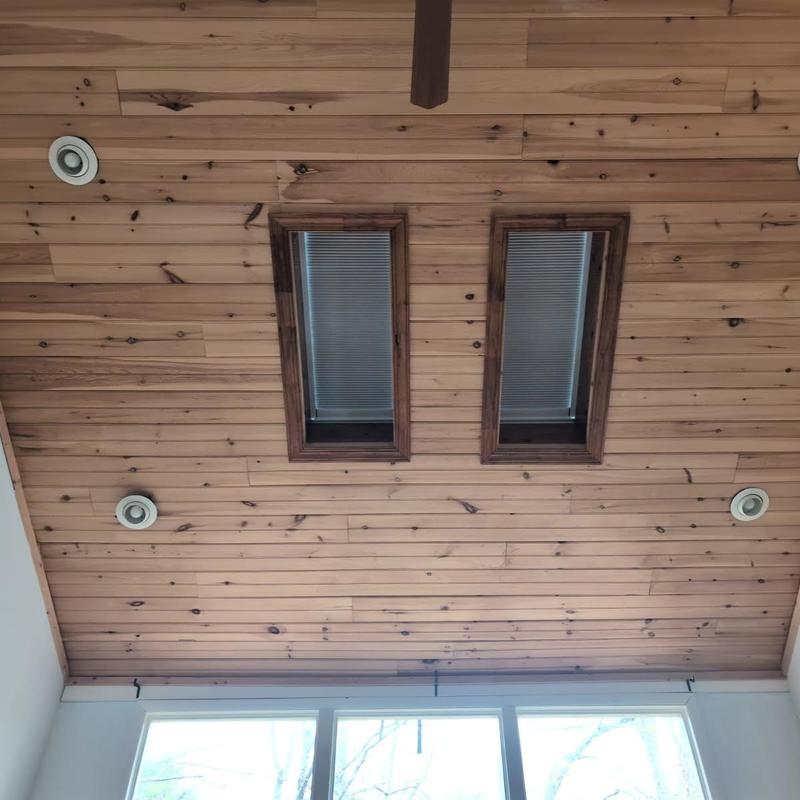 Skylights and wood ceiling with recessed lighting installed Skylights and wood ceiling with recessed lighting installed