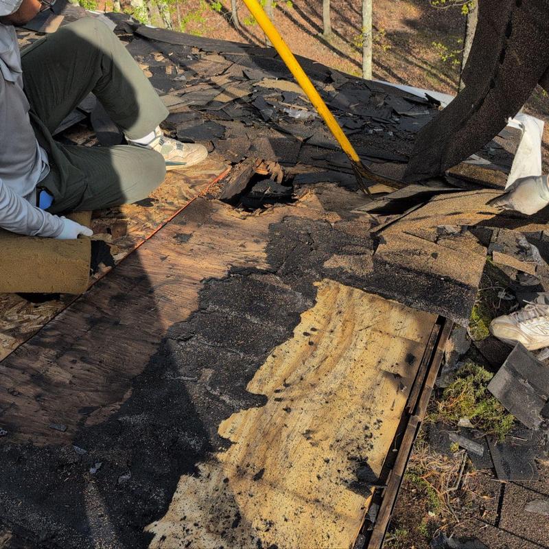 Roof plywood removal under damaged shingles on house roof Roof plywood removal under damaged shingles on house roof