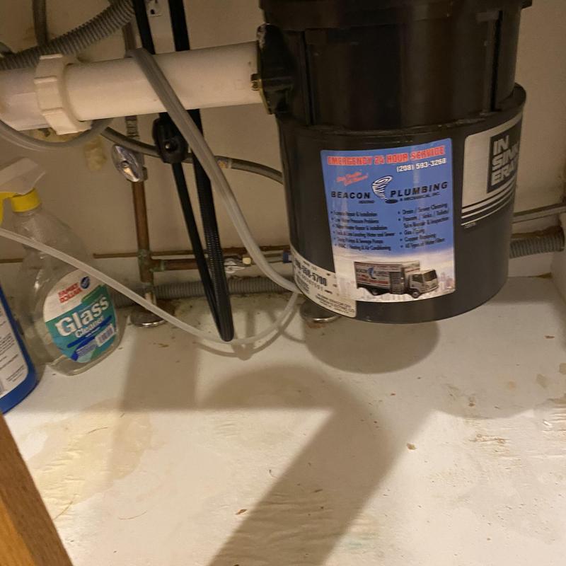 Dishwasher water valve and braided supply line under sink
