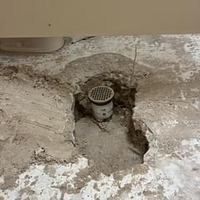 3-inch PVC floor drain installed in concrete slab gap