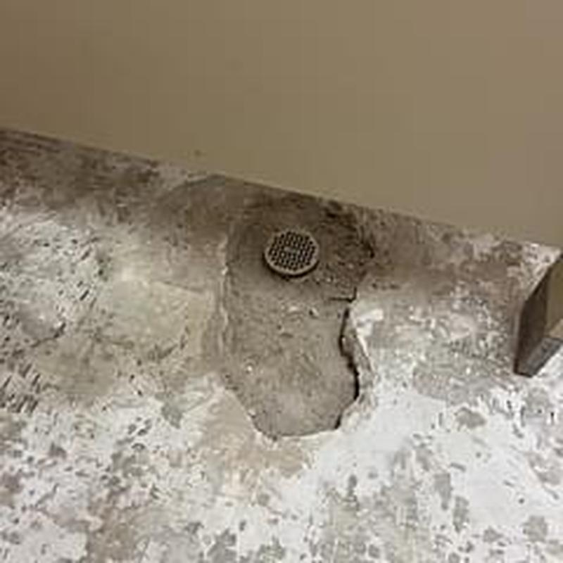 Concrete slab floor drain opening with exposed drain cover
