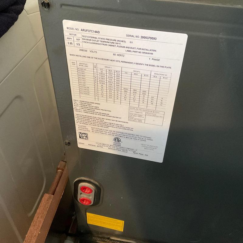 Heat strip assembly label on HVAC unit panel