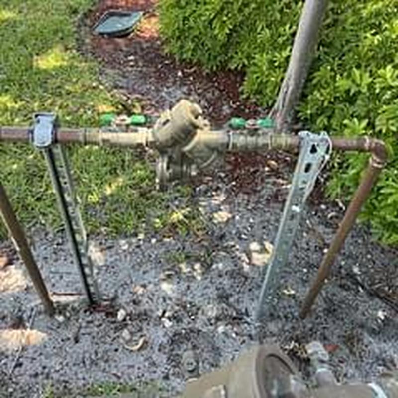 Backflow prevention device installation and support system