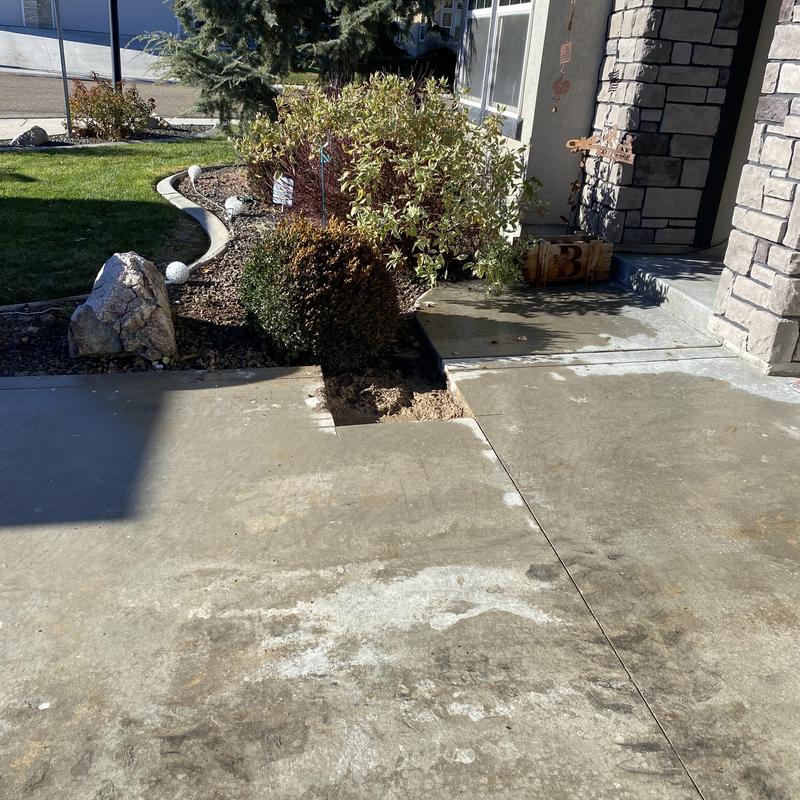 Concrete driveway cutout over sewer pipe repair site