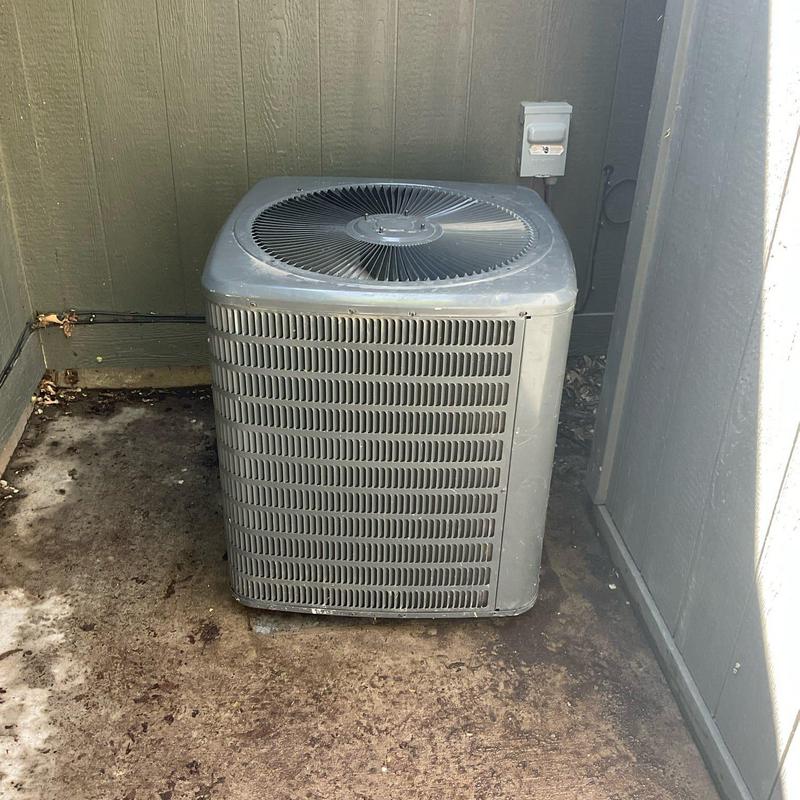 Outdoor air conditioning condenser unit in corner area