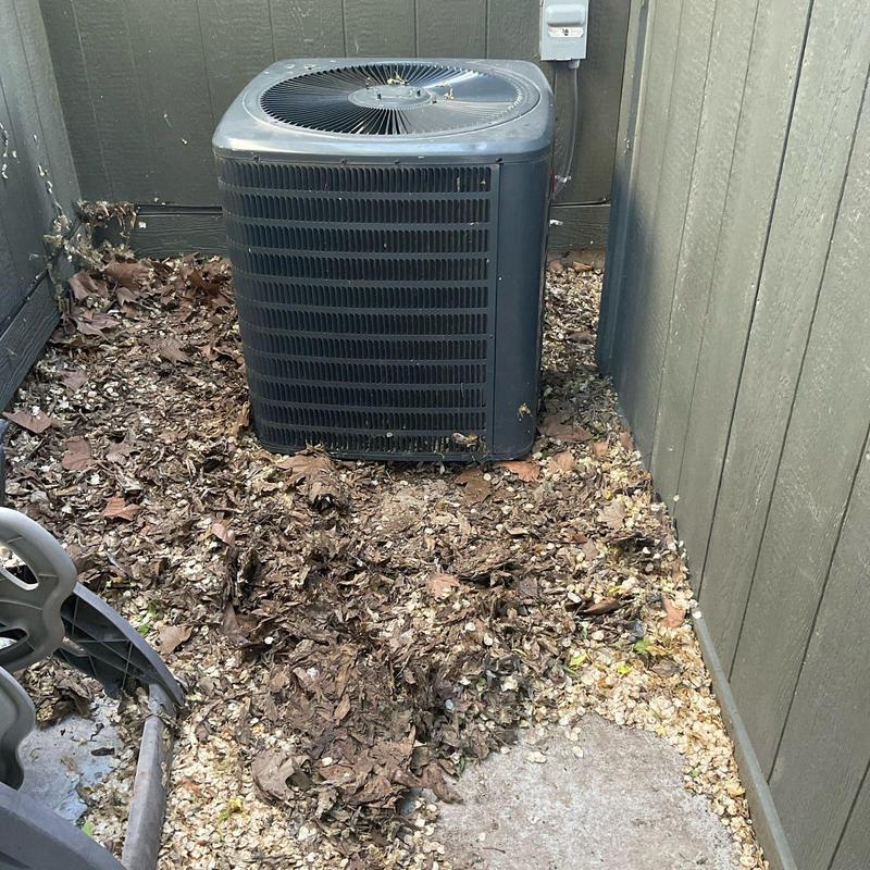 Outdoor air conditioner condenser with leaf debris buildup