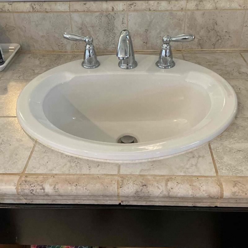 Bathroom sink faucet with chrome handles and spout