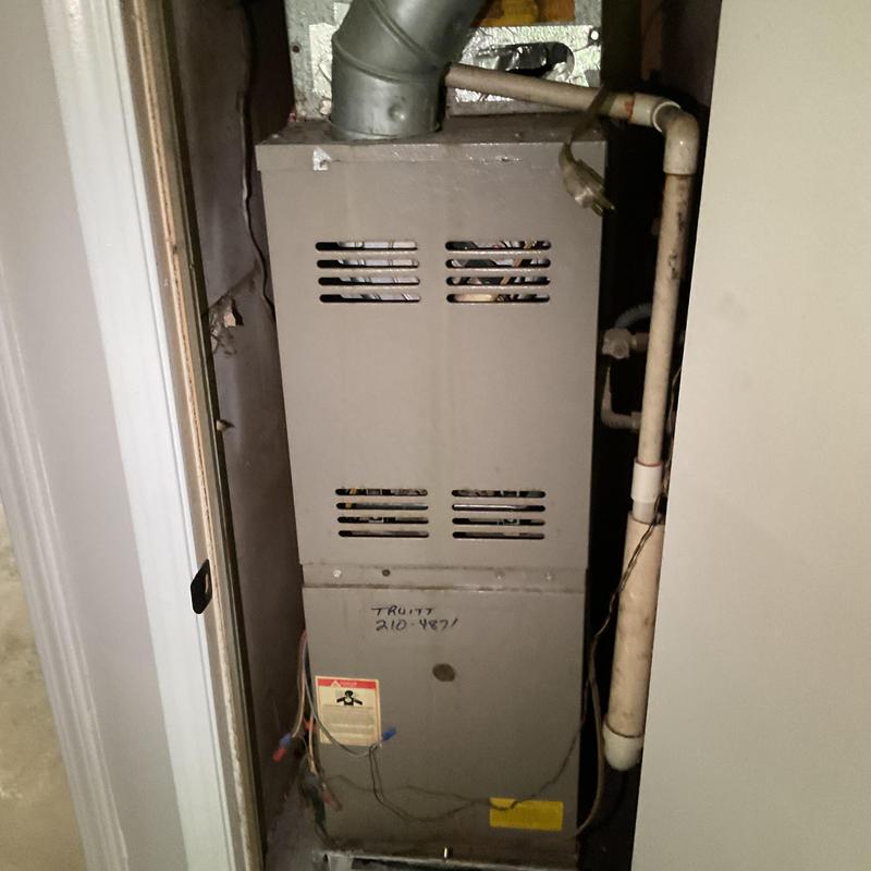 1999 Furnace unit with vent and pipes in closet