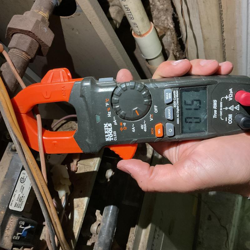 Electrical clamp meter on furnace wiring