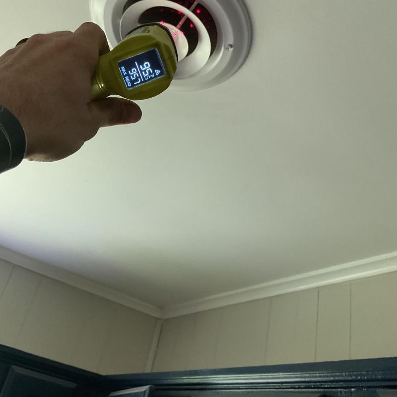 Ceiling air vent temperature check with infrared thermometer
