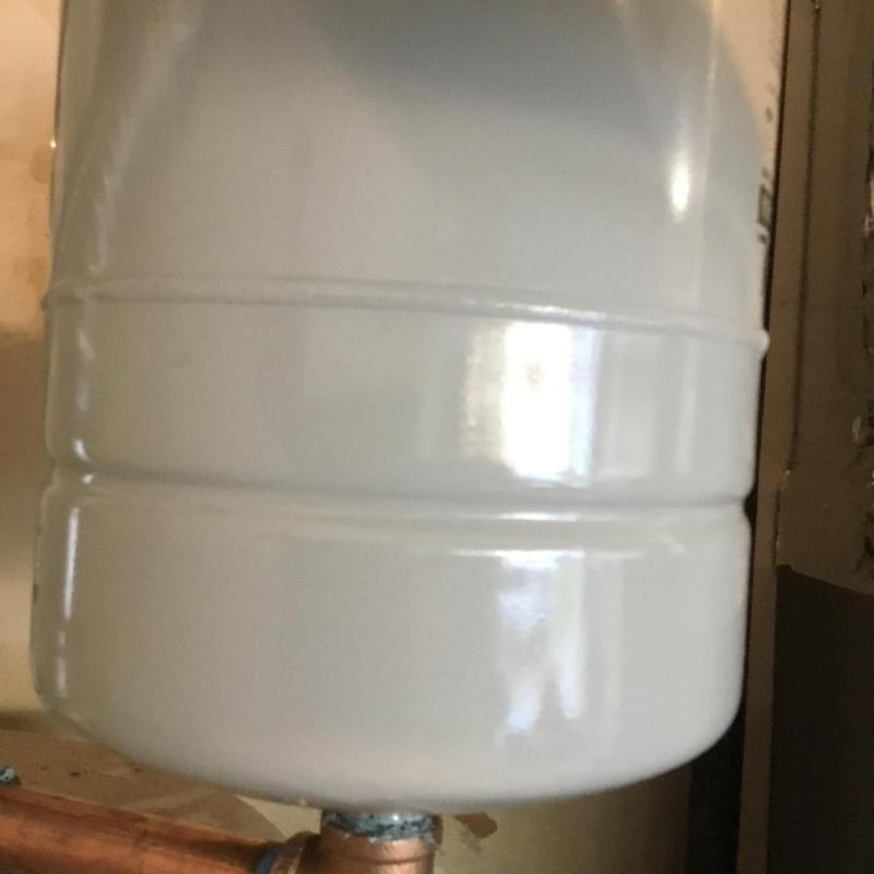Expansion tank and brass pipe on hot water heater
