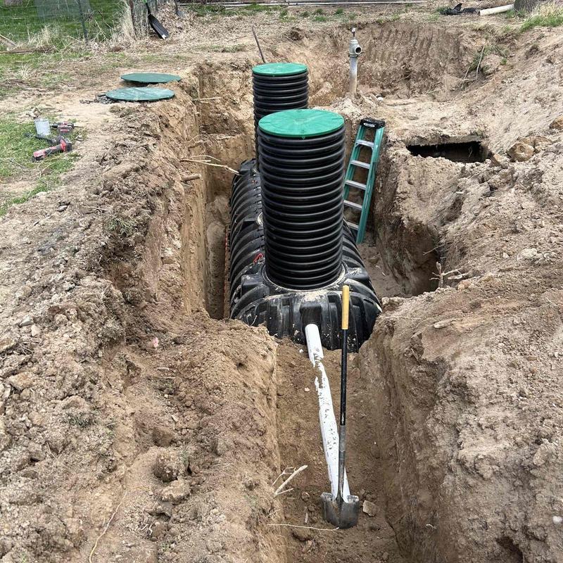Septic tank and drainfield excavation with piping access