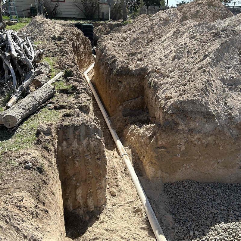 Septic tank drain line excavated for inspection and repair