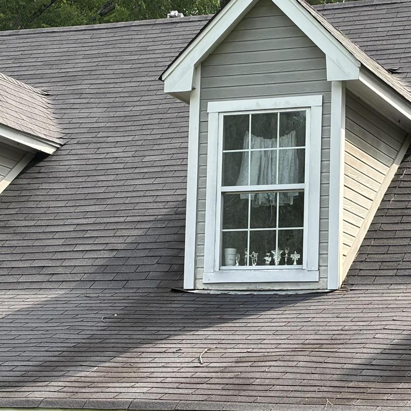 Asphalt shingle roof with dormer window inspection