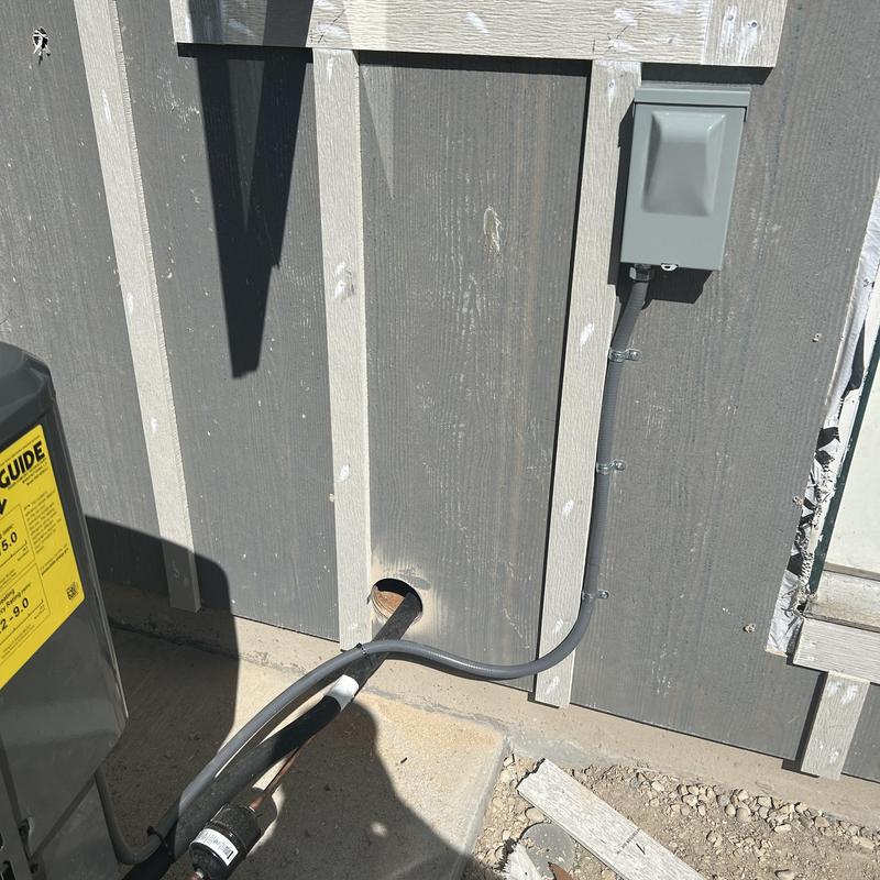 Air conditioning disconnect box relocated and wired outside