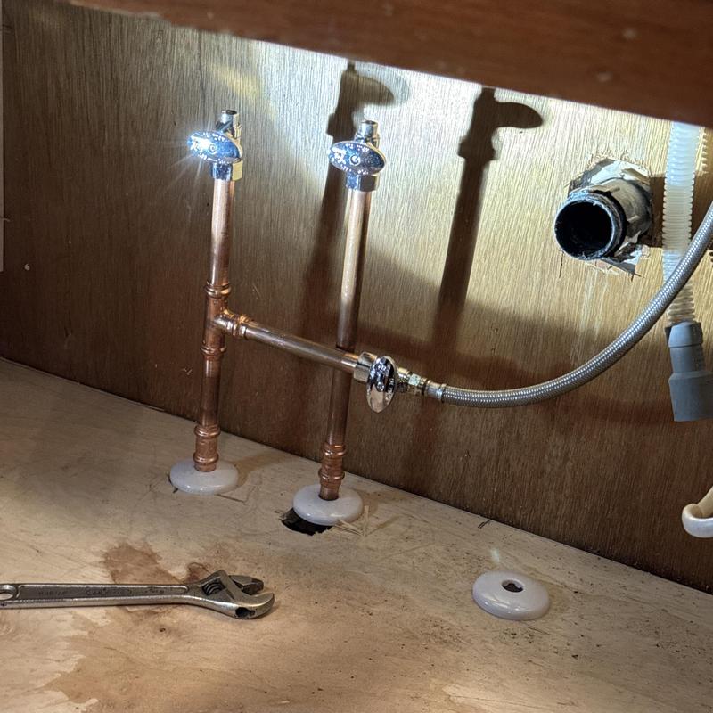 Kitchen sink shut-off valves and plumbing connections installation