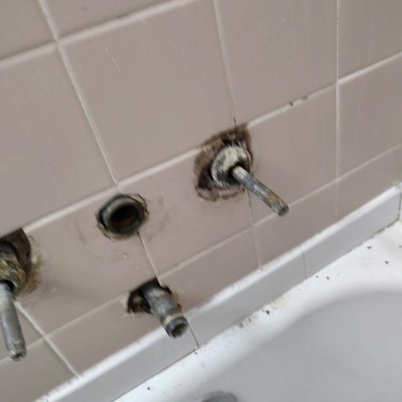 3-handle tub shower faucet valve stems removed