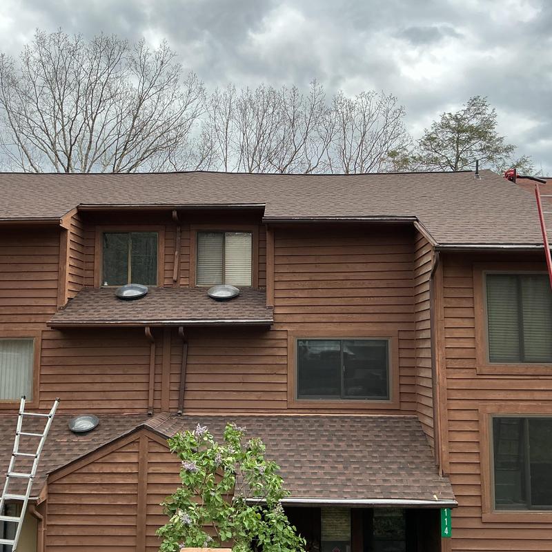 Asphalt shingle roof installation on residential home Asphalt shingle roof installation on residential home
