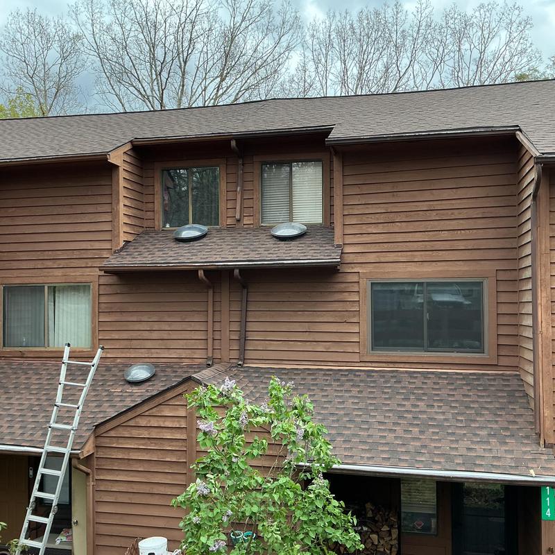 Asphalt shingle roof with skylights on townhome Asphalt shingle roof with skylights on townhome