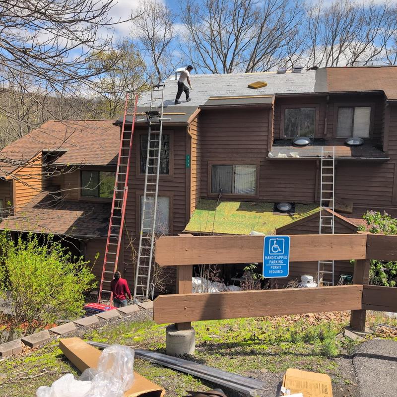 GAF Hickory shingle roof installation in progress GAF Hickory shingle roof installation in progress