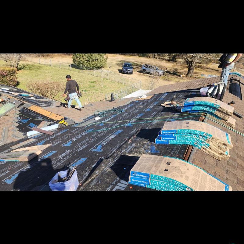 Asphalt shingle roof installation in progress Asphalt shingle roof installation in progress