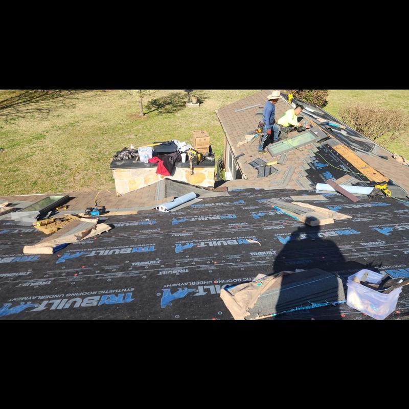 Synthetic roofing underlayment installation on sloped roof Synthetic roofing underlayment installation on sloped roof