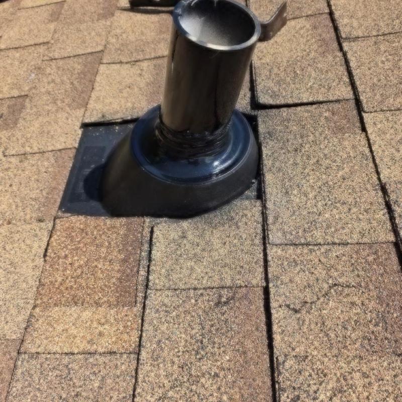 Pipe boot on shingle roof with sealant applied Pipe boot on shingle roof with sealant applied