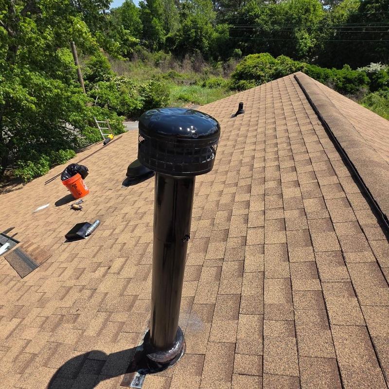 Pipe vent boot on shingled roof with repair tools Pipe vent boot on shingled roof with repair tools