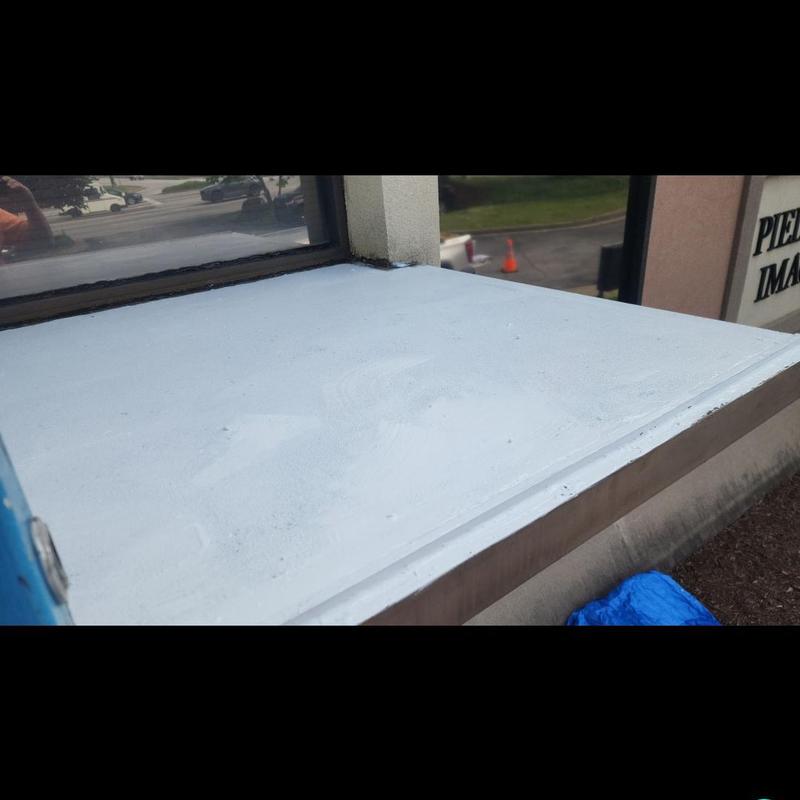 Concrete roof silicone coating system on flat roof edge Concrete roof silicone coating system on flat roof edge