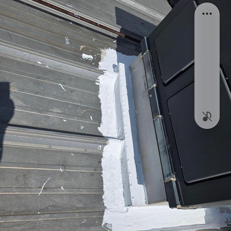 Metal roof leak sealed around HVAC unit with silicone Metal roof leak sealed around HVAC unit with silicone
