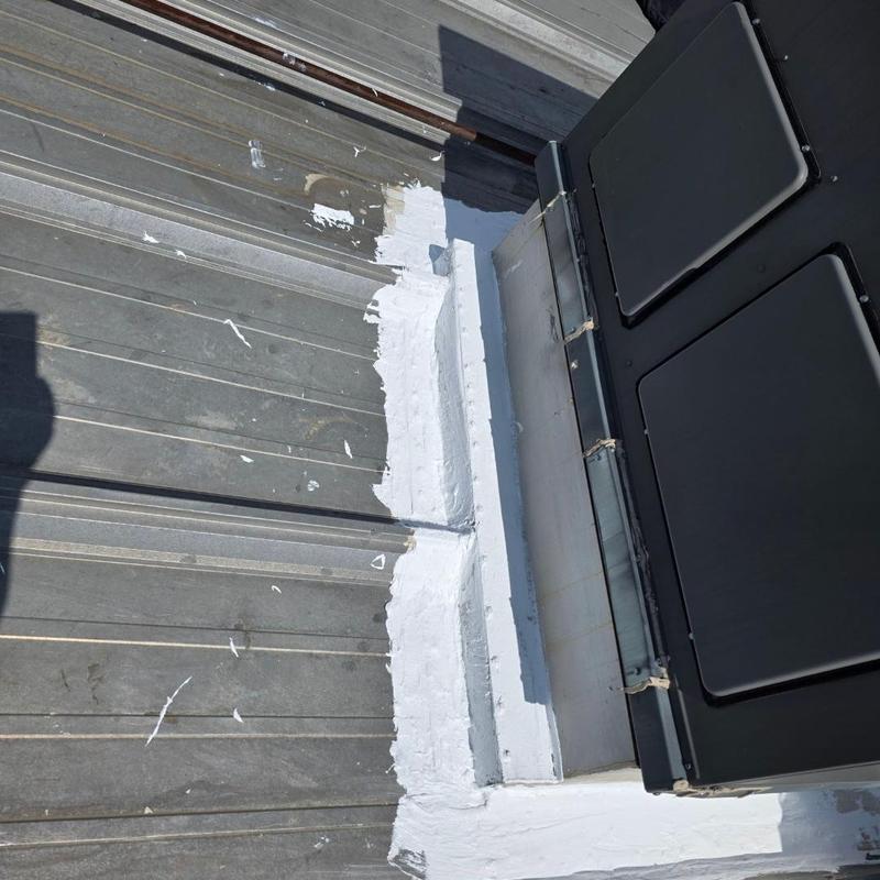 Metal roof HVAC seal with white silicone coating Metal roof HVAC seal with white silicone coating