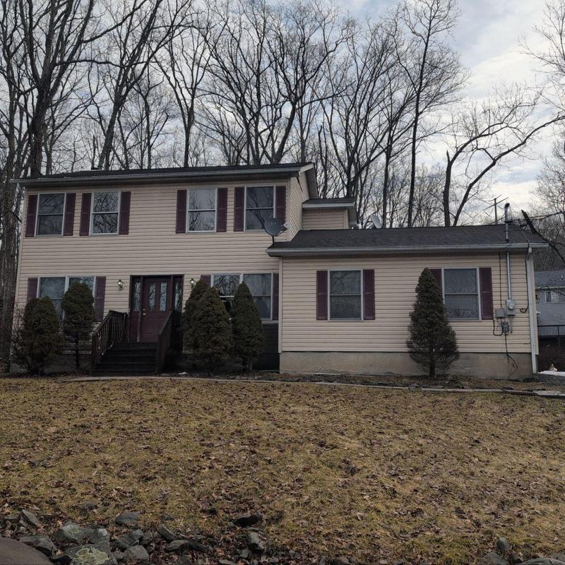 Asphalt shingle roof inspection on residential house Asphalt shingle roof inspection on residential house