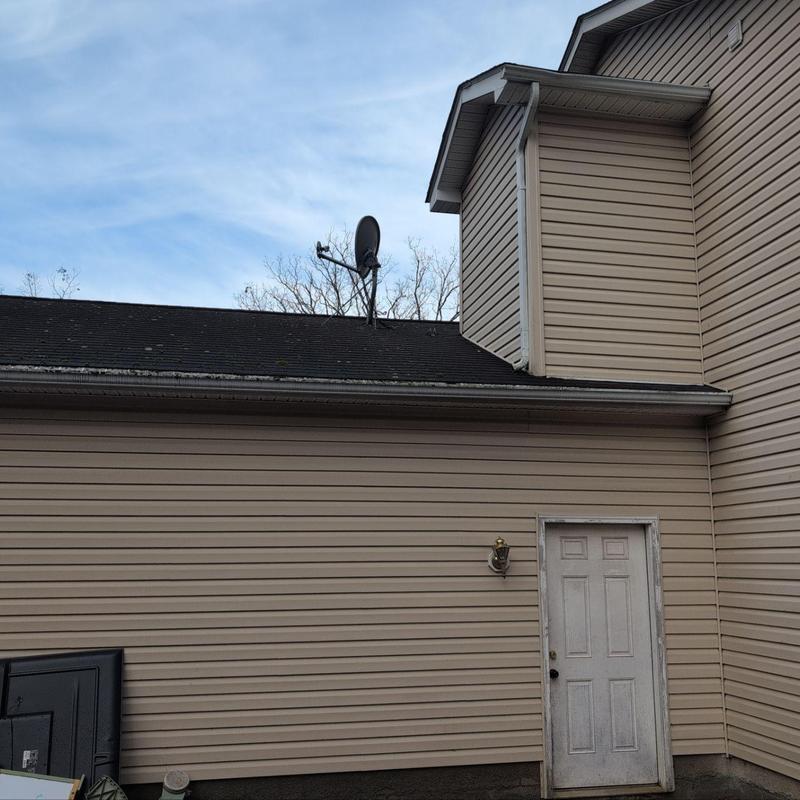 Roof shingles and flashing on residential home exterior Roof shingles and flashing on residential home exterior