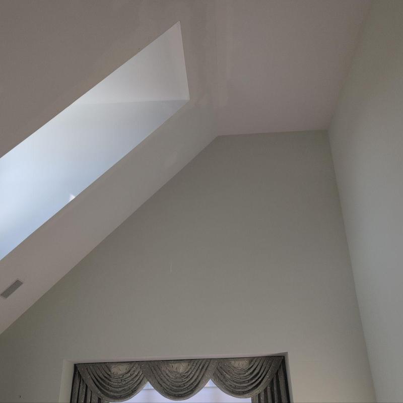 Interior wall and ceiling with skylight and window trim Interior wall and ceiling with skylight and window trim
