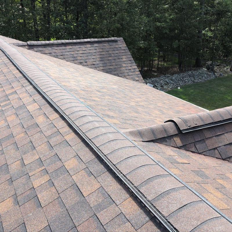 Asphalt shingle roof with ridge vent installation Asphalt shingle roof with ridge vent installation