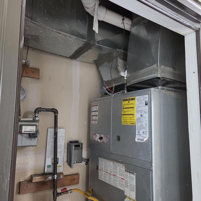 Furnace and ductwork in utility closet