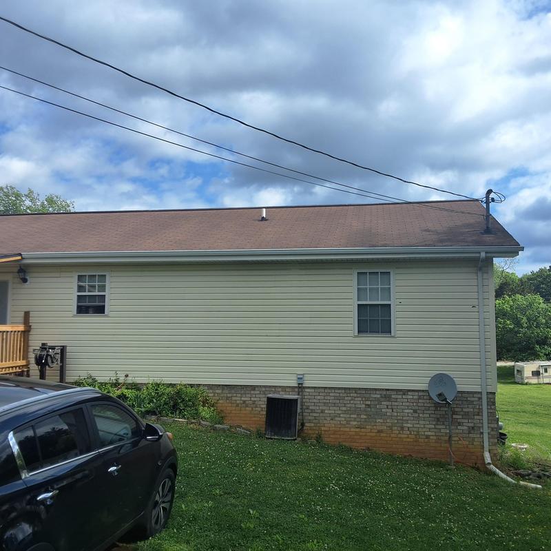Asphalt shingle roof with visible wear and leaks Asphalt shingle roof with visible wear and leaks