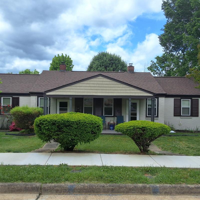 Asphalt shingle roof on residential duplex with porch Asphalt shingle roof on residential duplex with porch
