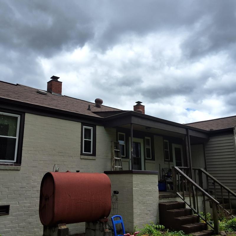 Roof shingles and chimneys on duplex exterior Roof shingles and chimneys on duplex exterior