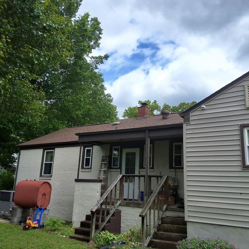Asphalt shingle roof on duplex with chimney Asphalt shingle roof on duplex with chimney
