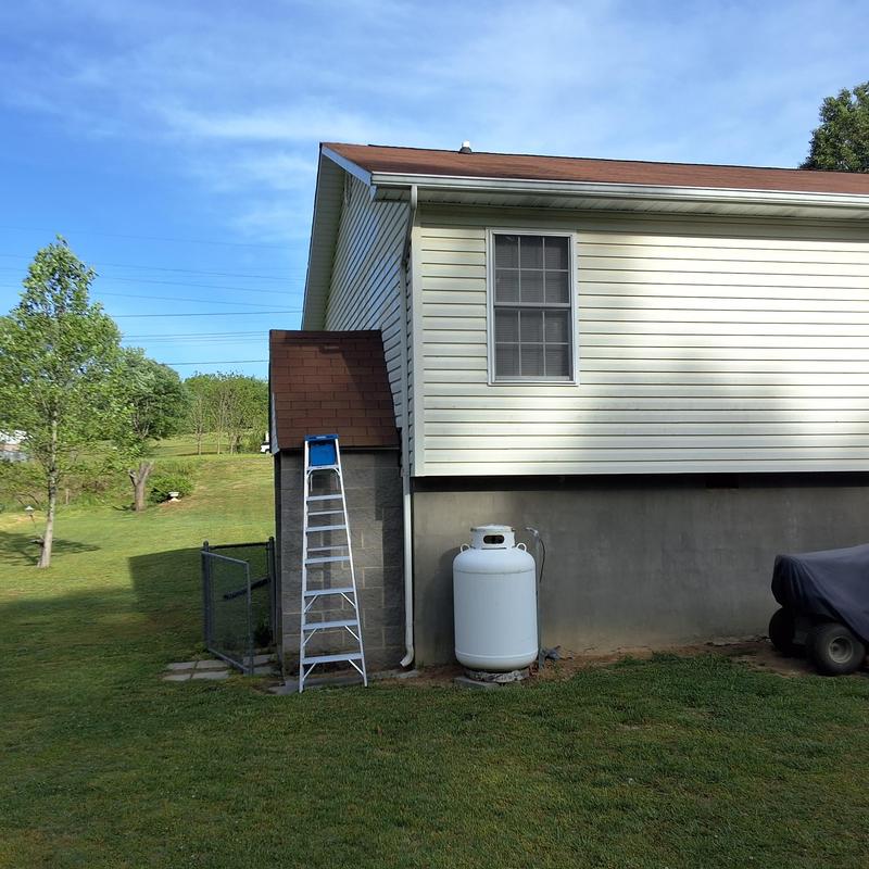 Roof shingles and gutter inspection on house exterior Roof shingles and gutter inspection on house exterior