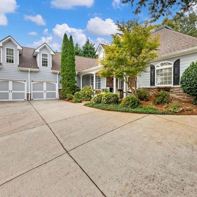 Asphalt shingle roof on suburban home with driveway