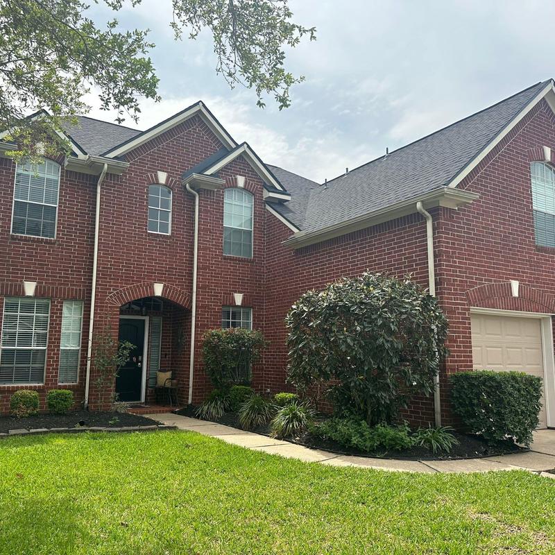 GAF HDZ Timberline Charcoal roofing on brick home